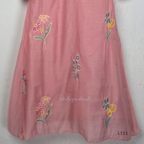 Dusty rose pink mul chanderi A-line kurti with scattered floral embroidery, V-neck stitch detail and 3/4 sleeves