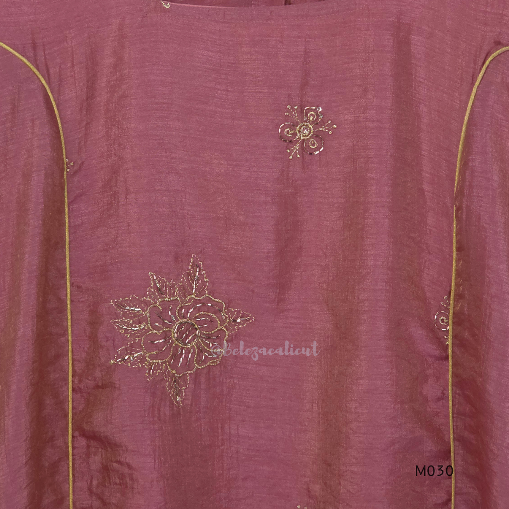 Dusty rose 2-piece kurti set with gold floral motifs, gold piping detail, matching bottom, 3/4 sleeves, and relaxed flared fit.