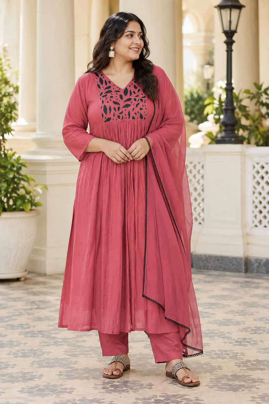 Dusty rose pink Mul Chanderi full churidar set with black leaf-shaped neckline work, matching straight pants and chiffon dupatta.