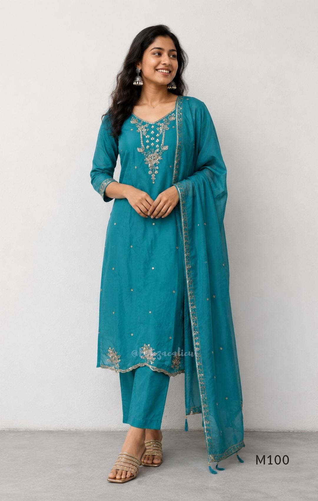 Pink, lavender, teal and mustard crushed silk churidar sets with gold-toned embroidery, matching bottoms and dupattas.