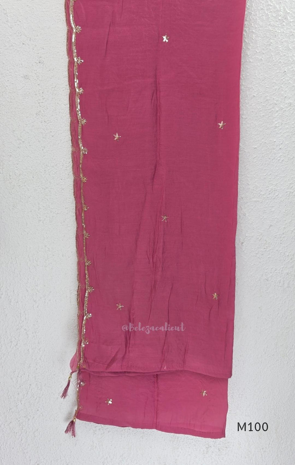 Pink, lavender, teal and mustard crushed silk churidar sets with gold-toned embroidery, matching bottoms and dupattas.