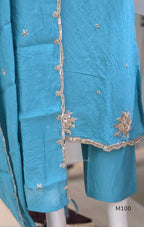 Pink, lavender, teal and mustard crushed silk churidar sets with gold-toned embroidery, matching bottoms and dupattas.