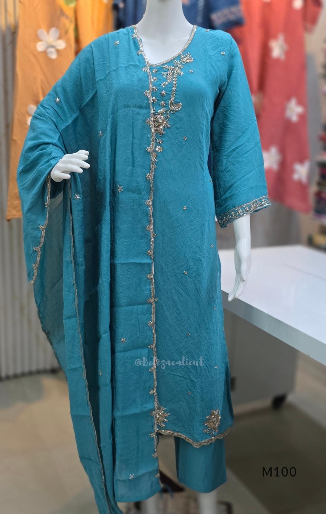 Pink, lavender, teal and mustard crushed silk churidar sets with gold-toned embroidery, matching bottoms and dupattas.
