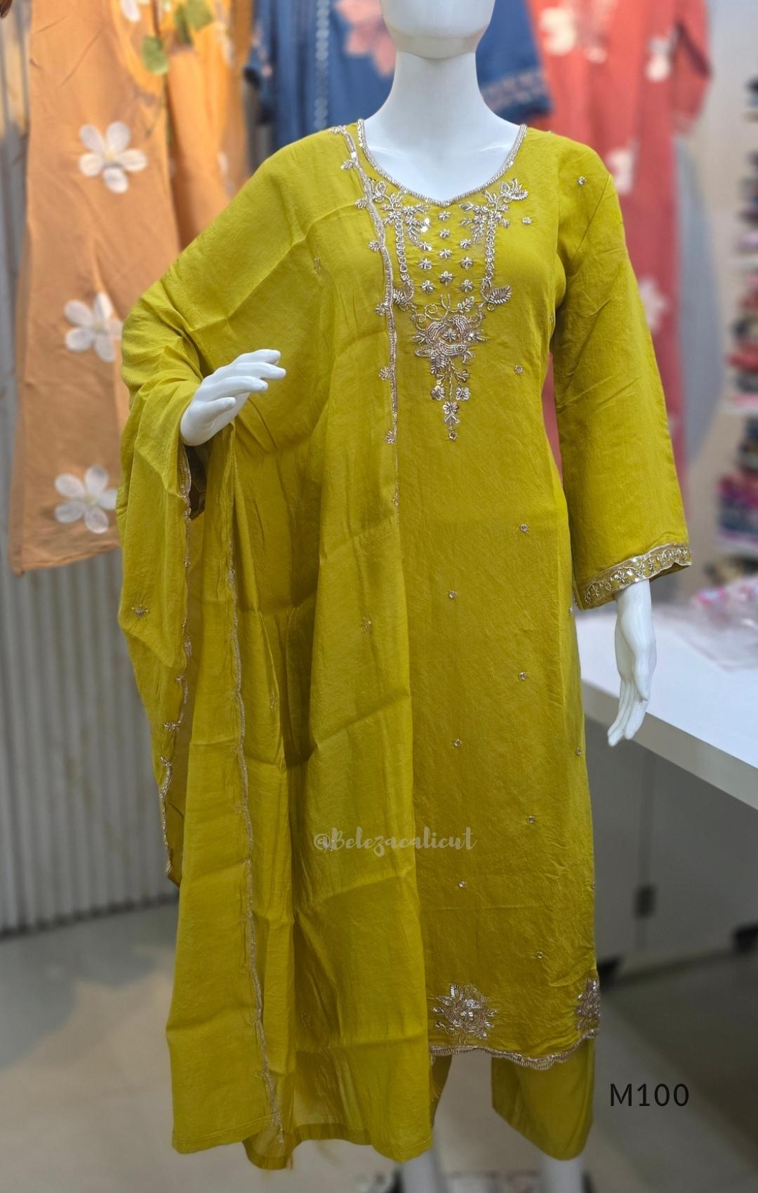 Pink, lavender, teal and mustard crushed silk churidar sets with gold-toned embroidery, matching bottoms and dupattas.