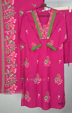 Pink cotton three-piece churidar set with floral print, green lace and embroidered neckline details, plain wide palazzo pants and a floral-border dupatta. - view 2