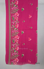 Pink cotton three-piece churidar set with floral print, green lace and embroidered neckline details, plain wide palazzo pants and a floral-border dupatta. - view 4