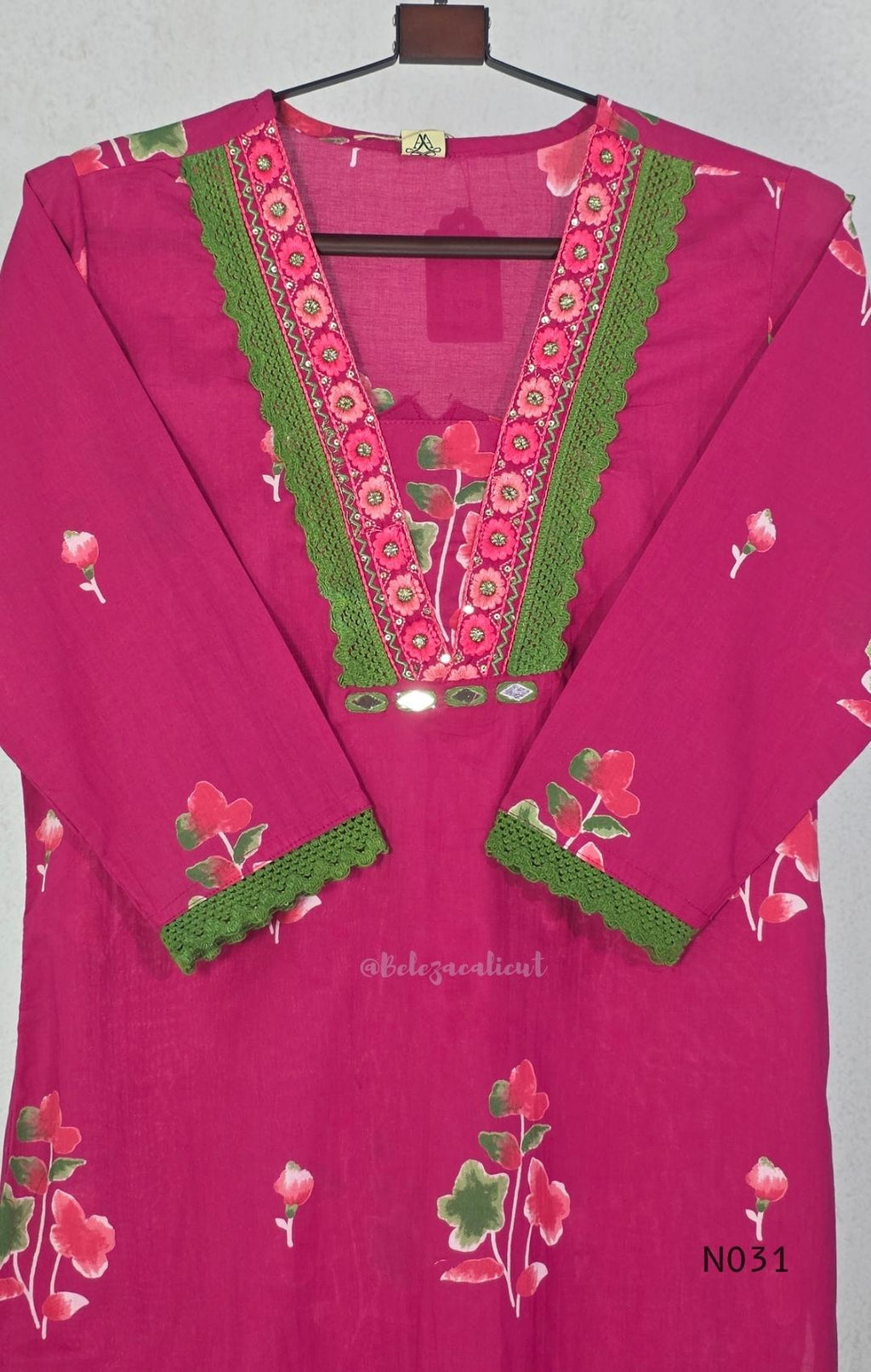 Pink cotton three-piece churidar set with floral print, green lace and embroidered neckline details, plain wide palazzo pants and a floral-border dupatta. - view 5
