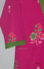 Pink cotton three-piece churidar set with floral print, green lace and embroidered neckline details, plain wide palazzo pants and a floral-border dupatta. - view 7