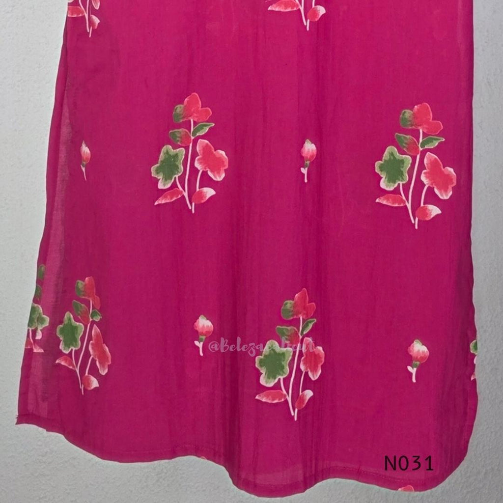 Pink cotton three-piece churidar set with floral print, green lace and embroidered neckline details, plain wide palazzo pants and a floral-border dupatta. - view 9