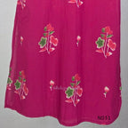Pink cotton three-piece churidar set with floral print, green lace and embroidered neckline details, plain wide palazzo pants and a floral-border dupatta. - view 9
