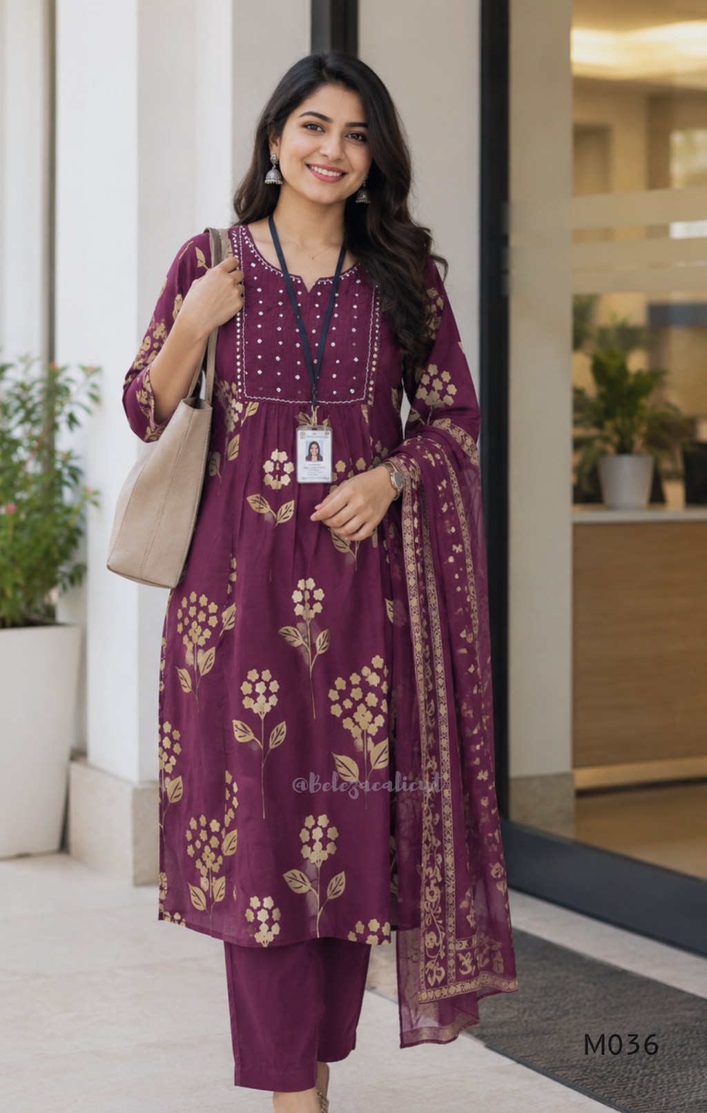 Grape cotton churidar set with cream floral stem print, stitched mirror-style yoke work, matching printed dupatta, plain bottom, and 3/4 sleeves.