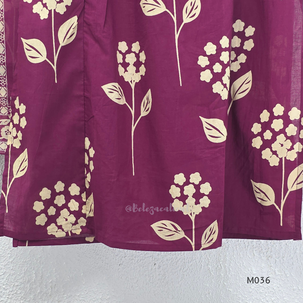 Grape cotton churidar set with cream floral stem print, stitched mirror-style yoke work, matching printed dupatta, plain bottom, and 3/4 sleeves.