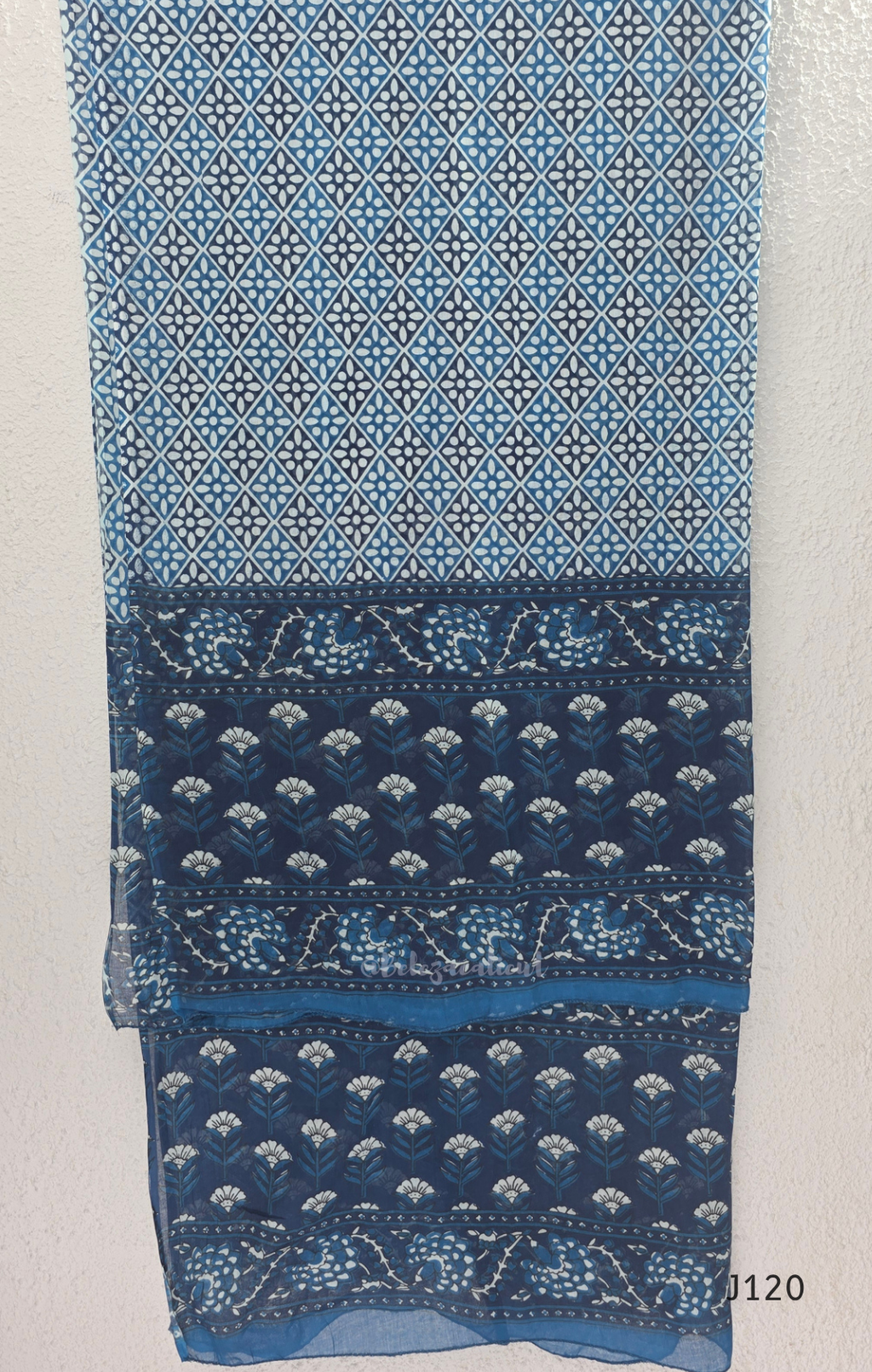 Indigo blue Jaipur cotton 3-piece churidar set with white floral print, embroidered V-neck, printed dupatta and matching printed bottom.