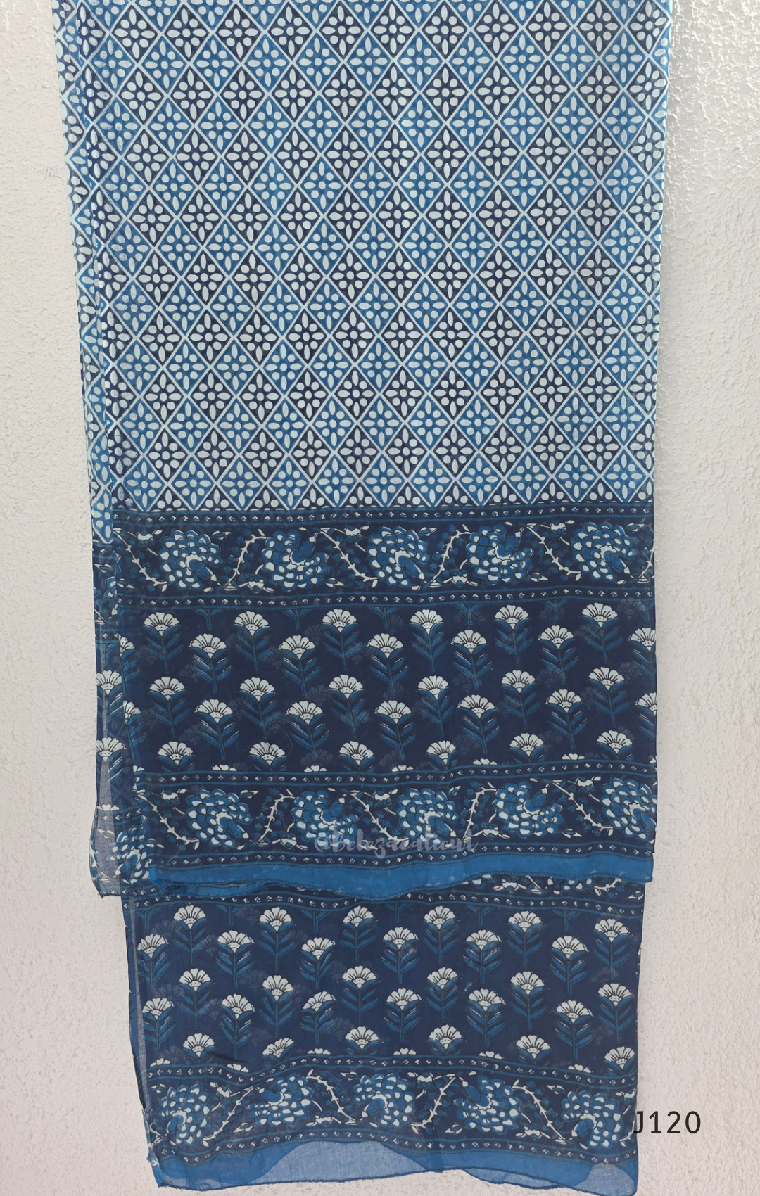 Indigo blue Jaipur cotton 3-piece churidar set with white floral print, embroidered V-neck, printed dupatta and matching printed bottom.
