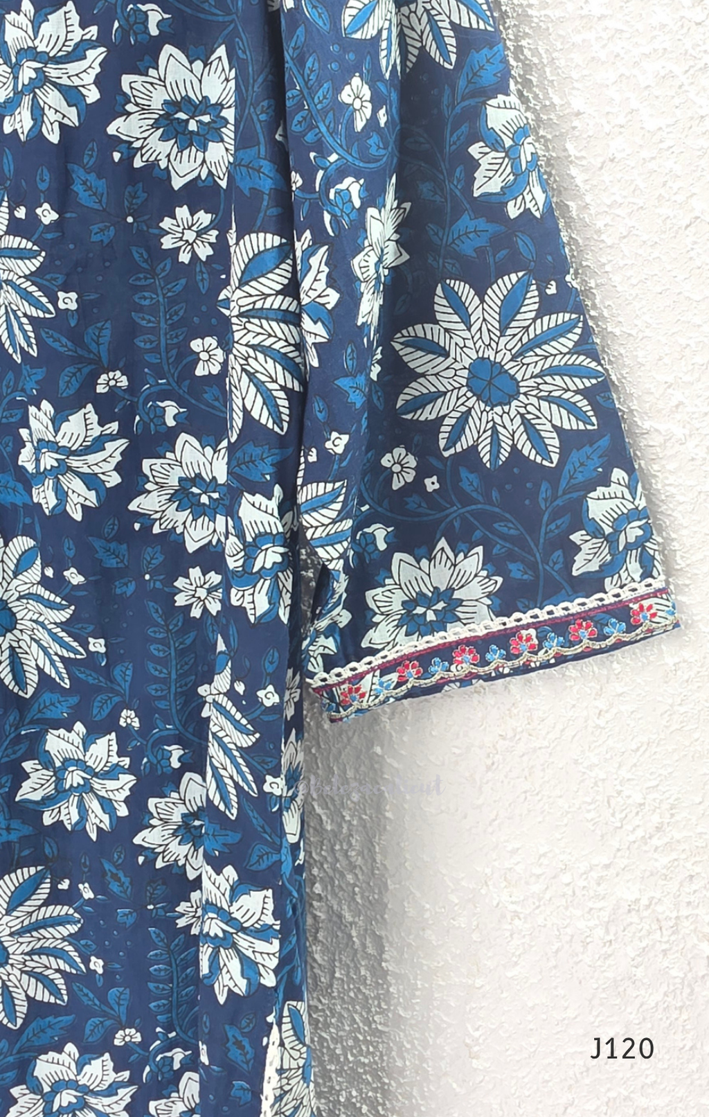 Indigo blue Jaipur cotton 3-piece churidar set with white floral print, embroidered V-neck, printed dupatta and matching printed bottom.