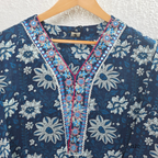 Indigo blue Jaipur cotton 3-piece churidar set with white floral print, embroidered V-neck, printed dupatta and matching printed bottom.