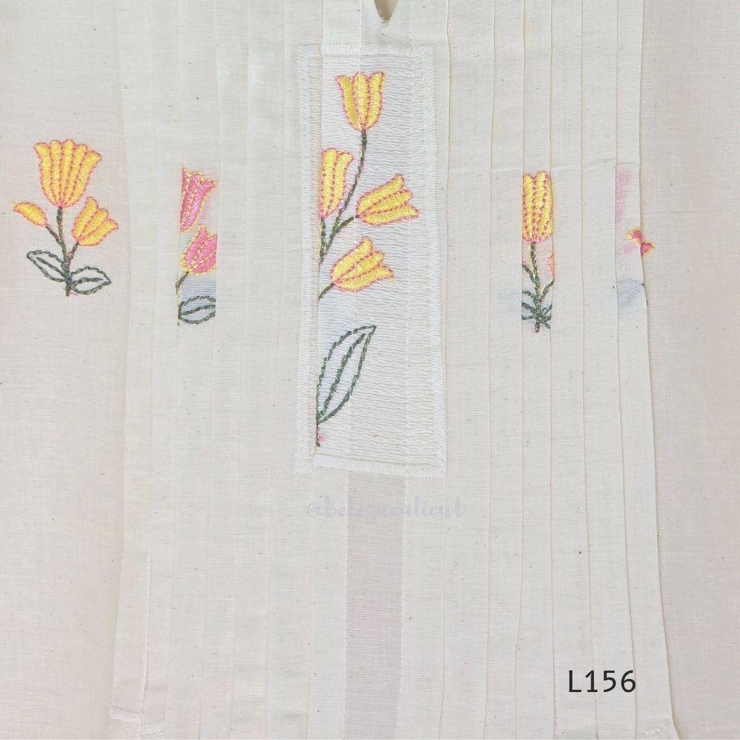 Ivory Cora Cotton churidar set with pink and yellow floral embroidery, matching straight pants and embroidered dupatta.