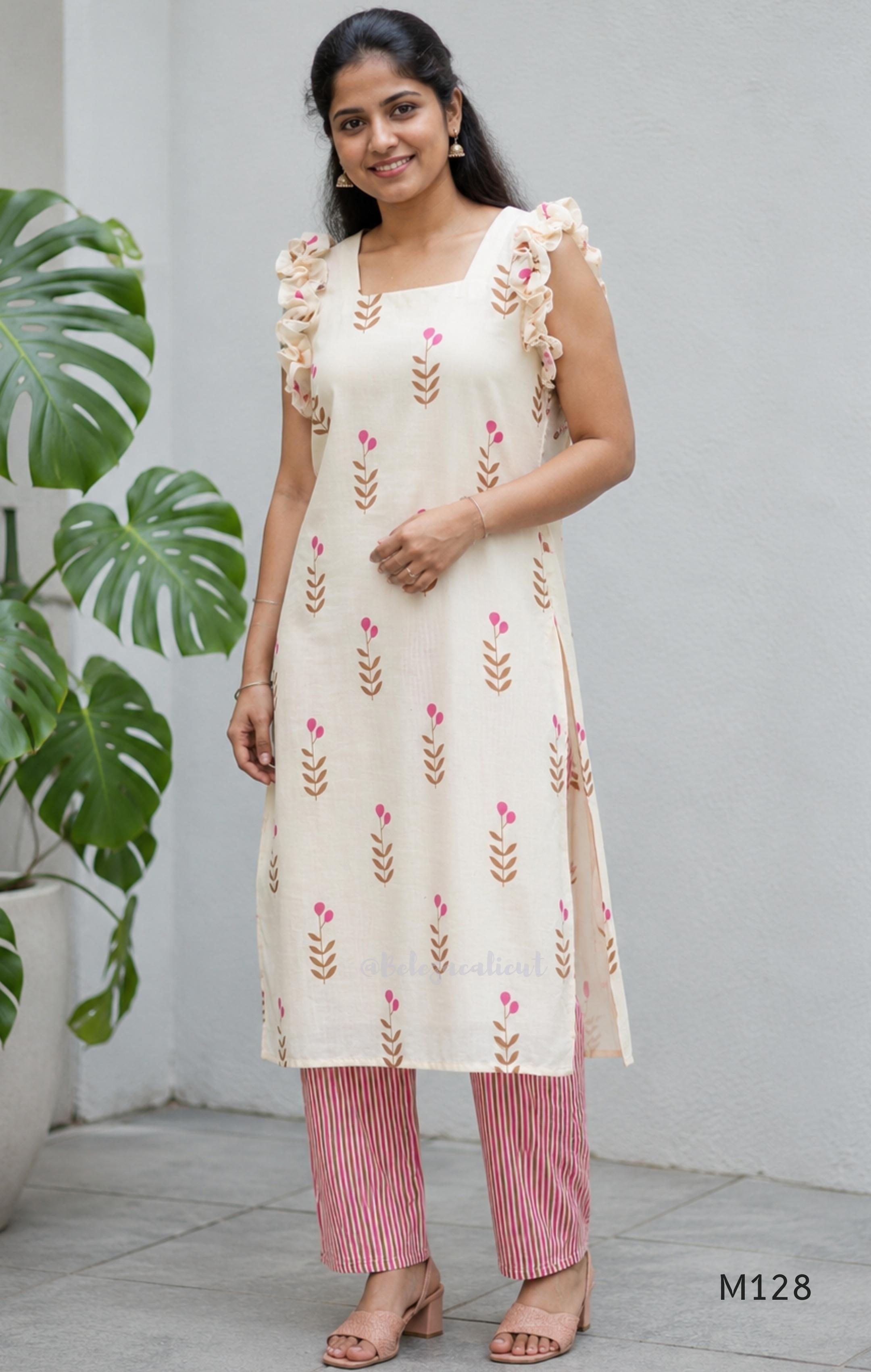 Ivory cotton 2-piece co-ord set with pink and brown botanical motifs, ruffled sleeveless shoulders and vertically striped matching bottom.