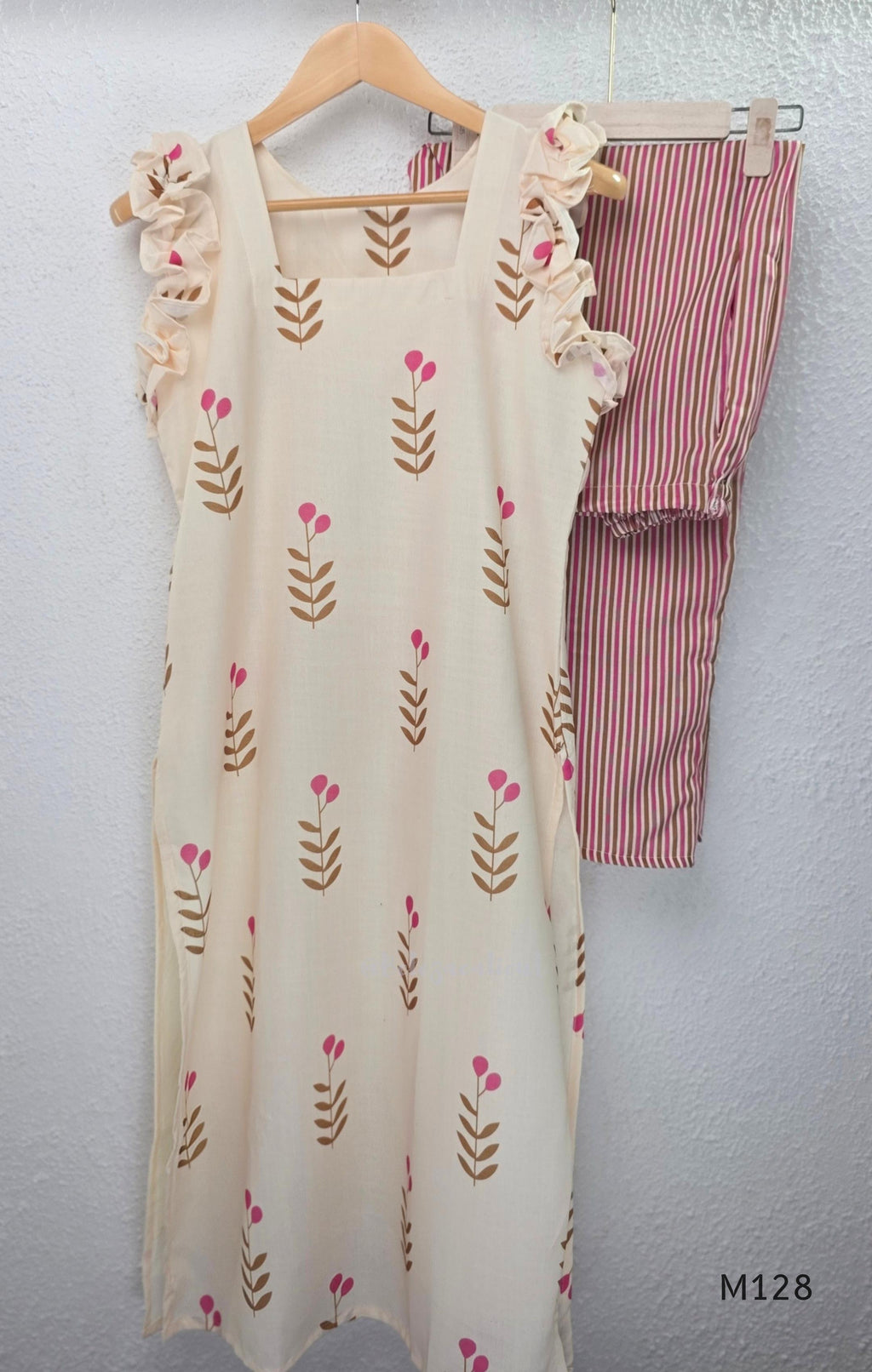 Ivory cotton 2-piece co-ord set with pink and brown botanical motifs, ruffled sleeveless shoulders and vertically striped matching bottom.
