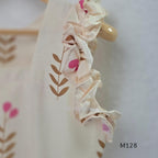Ivory cotton 2-piece co-ord set with pink and brown botanical motifs, ruffled sleeveless shoulders and vertically striped matching bottom.