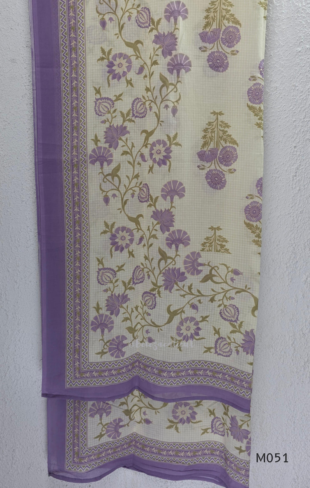 Ivory cotton 3-piece churidar set with dusty lavender floral motifs, contrast printed yoke, matching striped bottom and floral bordered dupatta.