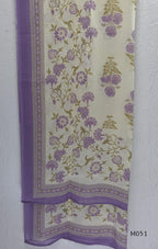 Ivory cotton 3-piece churidar set with dusty lavender floral motifs, contrast printed yoke, matching striped bottom and floral bordered dupatta.