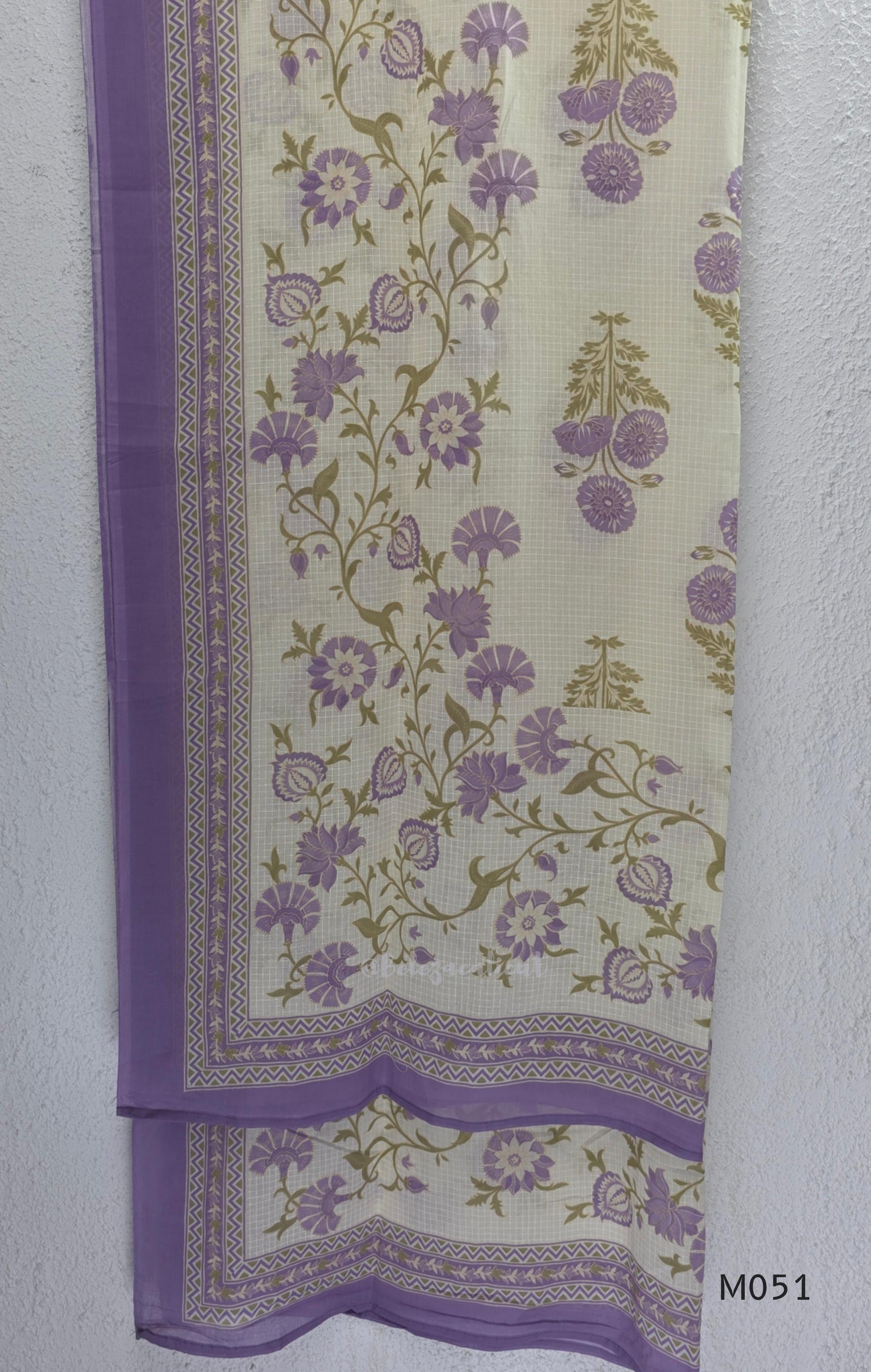 Ivory cotton 3-piece churidar set with dusty lavender floral motifs, contrast printed yoke, matching striped bottom and floral bordered dupatta.