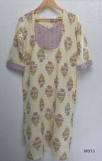 Ivory cotton 3-piece churidar set with dusty lavender floral motifs, contrast printed yoke, matching striped bottom and floral bordered dupatta.