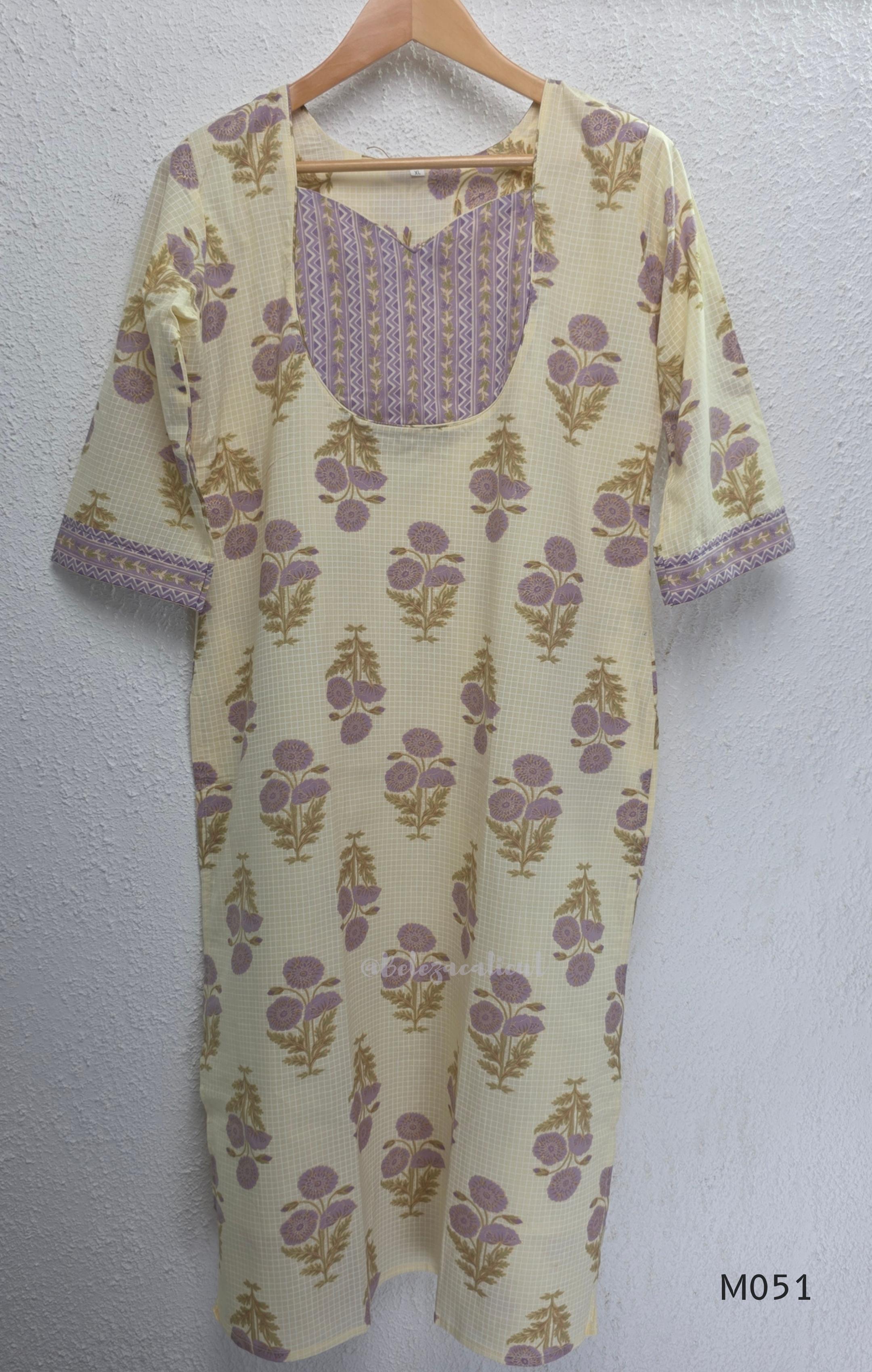 Ivory cotton 3-piece churidar set with dusty lavender floral motifs, contrast printed yoke, matching striped bottom and floral bordered dupatta.