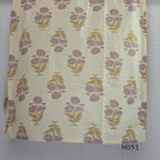 Ivory cotton 3-piece churidar set with dusty lavender floral motifs, contrast printed yoke, matching striped bottom and floral bordered dupatta.
