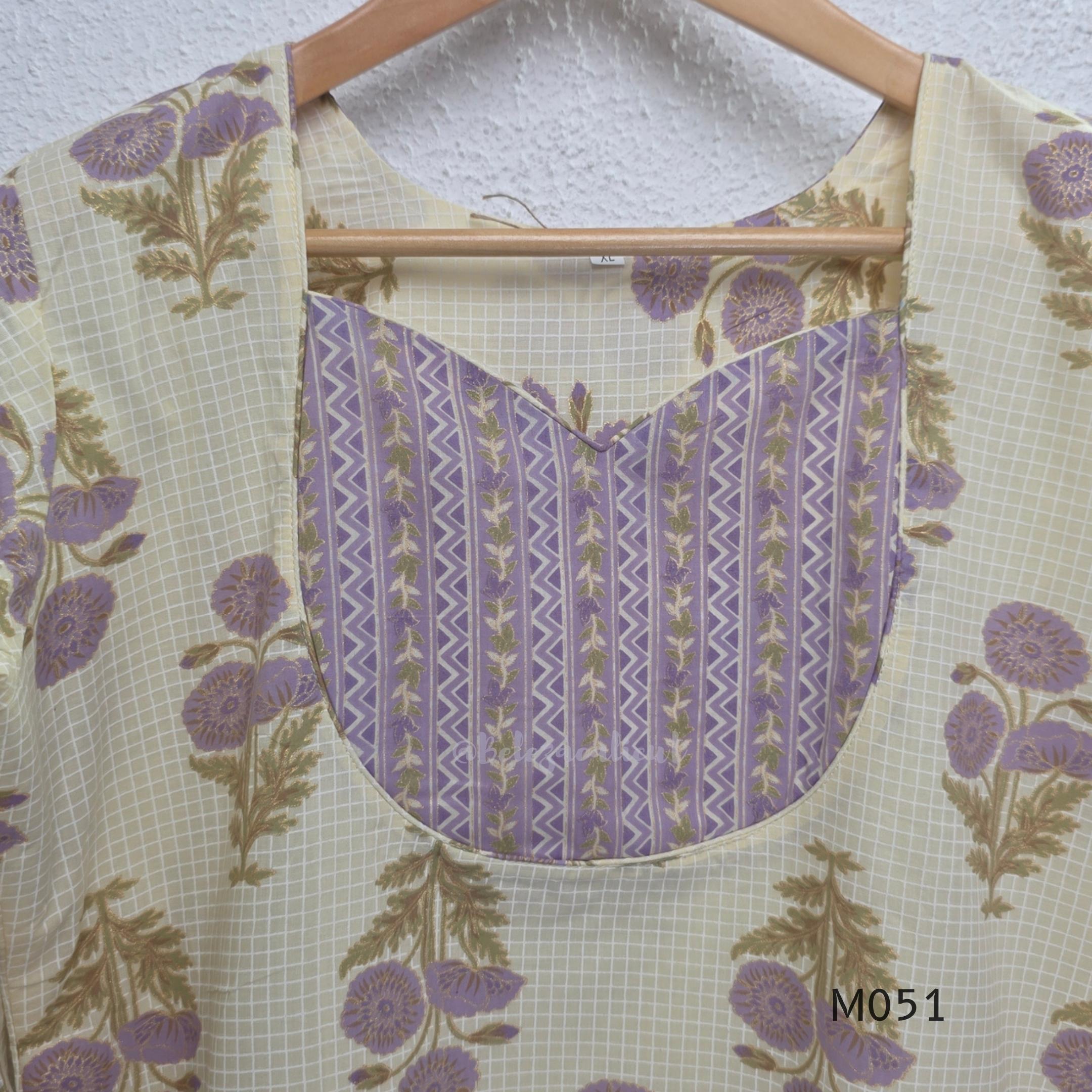 Ivory cotton 3-piece churidar set with dusty lavender floral motifs, contrast printed yoke, matching striped bottom and floral bordered dupatta.