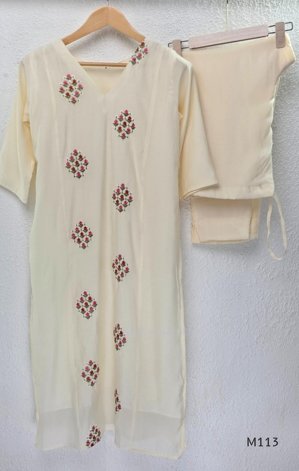 Ivory mul chanderi 2-piece co-ord set with pink-red floral embroidery, V-neck top and matching straight pant.