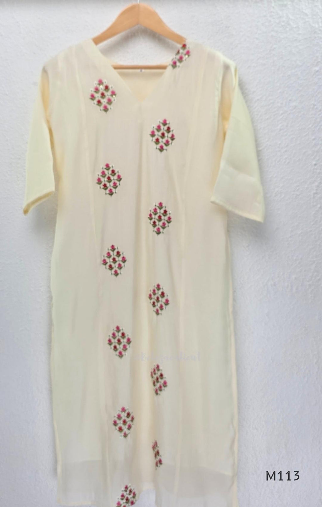 Ivory mul chanderi 2-piece co-ord set with pink-red floral embroidery, V-neck top and matching straight pant.