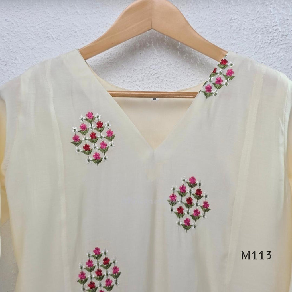 Ivory mul chanderi 2-piece co-ord set with pink-red floral embroidery, V-neck top and matching straight pant.
