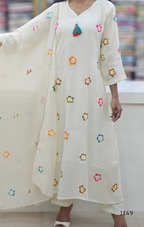 White kurta with colorful floral embroidery on a blurred background