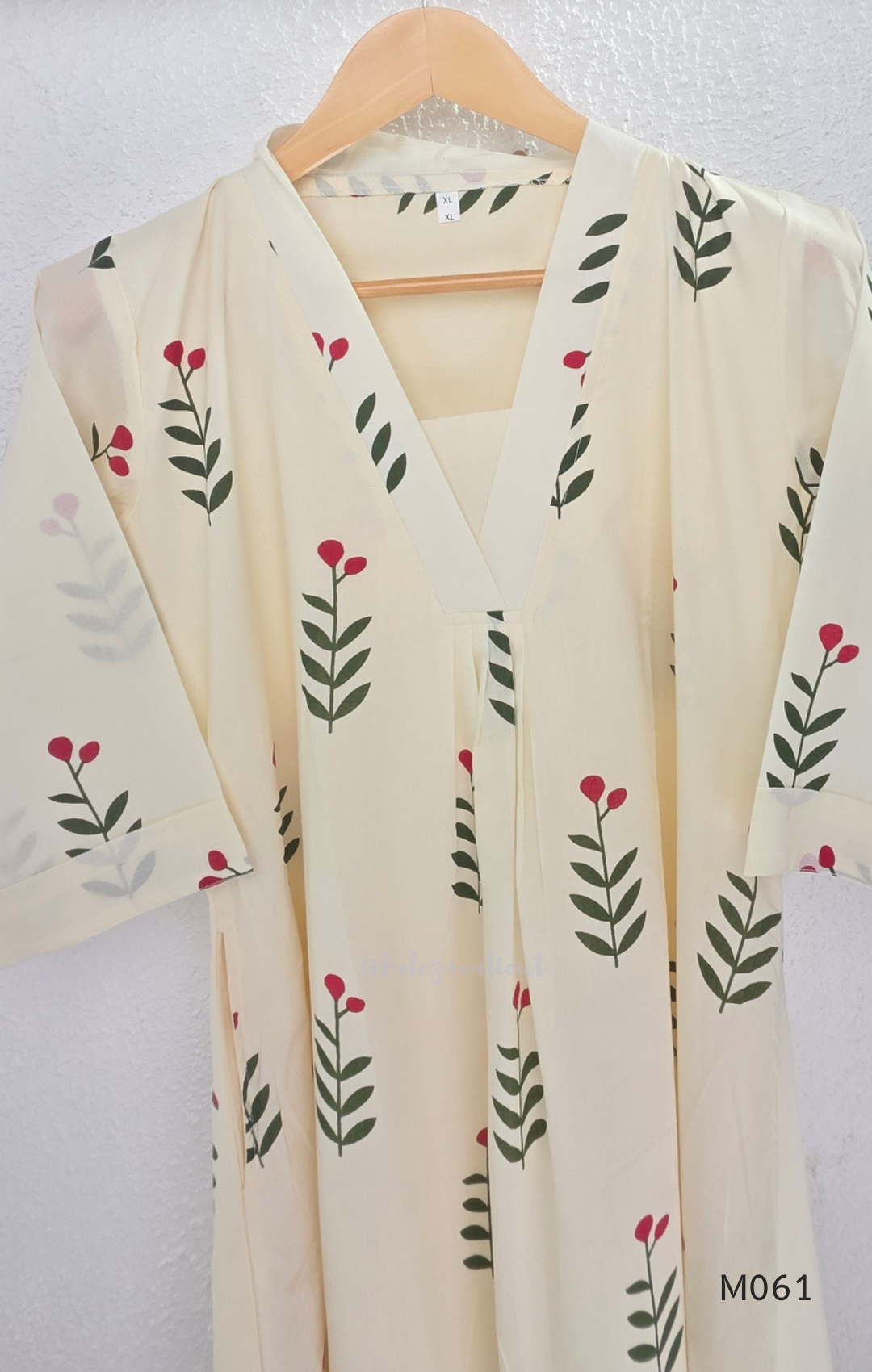 vory cotton lined 2-piece A-line set with green stem and pink blossom print, V-neck, relaxed fit, one pocket.