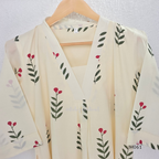 vory cotton lined 2-piece A-line set with green stem and pink blossom print, V-neck, relaxed fit, one pocket.