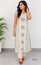 Ivory Vertigan silk co-ord set with dark circular motifs, wavy side-border print and matching straight pants.