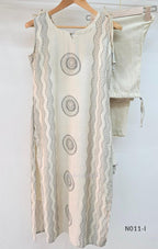 Ivory Vertigan silk co-ord set with dark circular motifs, wavy side-border print and matching straight pants.