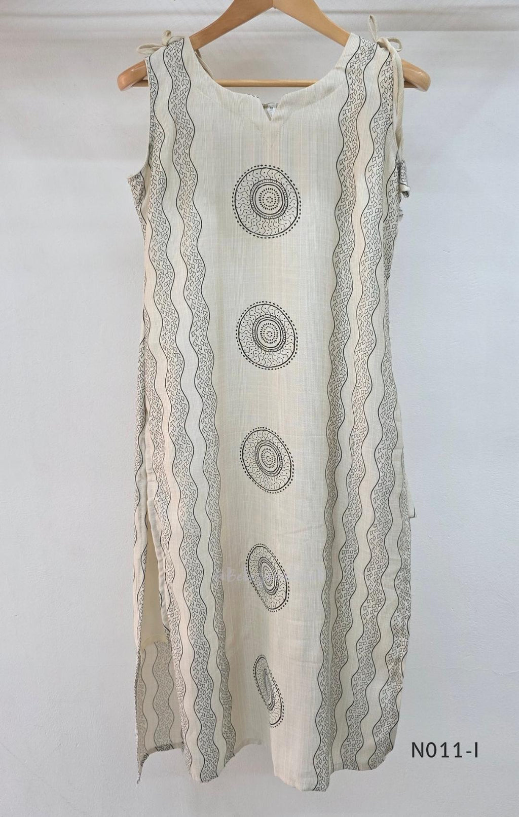 Ivory Vertigan silk co-ord set with dark circular motifs, wavy side-border print and matching straight pants.
