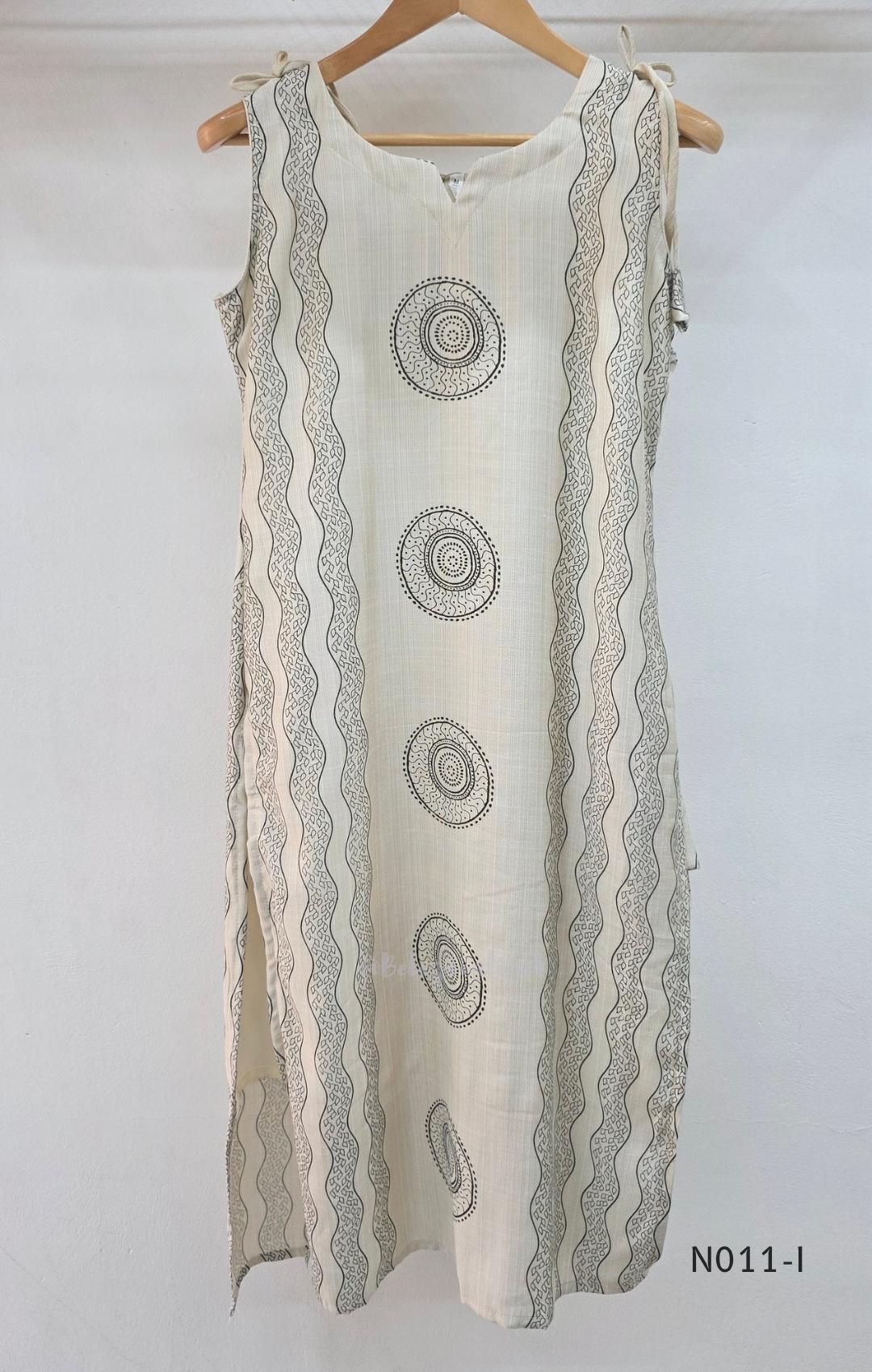 Ivory Vertigan silk co-ord set with dark circular motifs, wavy side-border print and matching straight pants.