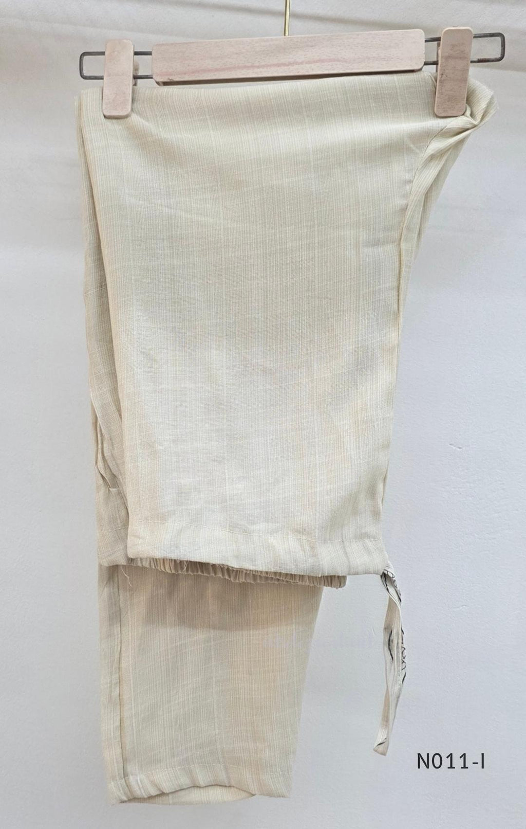 Ivory Vertigan silk co-ord set with dark circular motifs, wavy side-border print and matching straight pants.