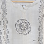 Ivory Vertigan silk co-ord set with dark circular motifs, wavy side-border print and matching straight pants.