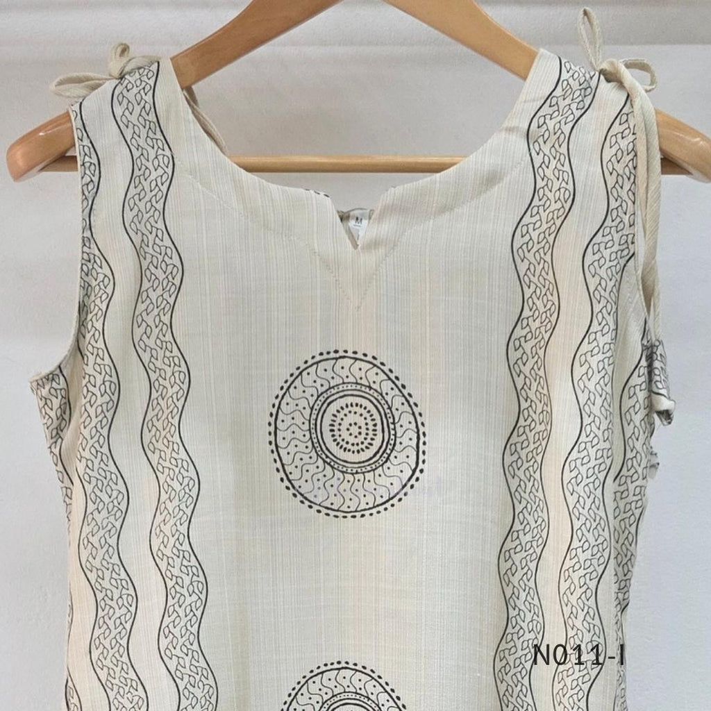 Ivory Vertigan silk co-ord set with dark circular motifs, wavy side-border print and matching straight pants.