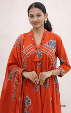 Woman wearing a red embroidered traditional outfit on a white background