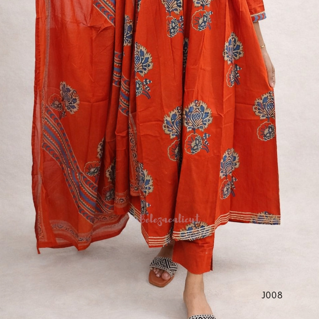 Orange traditional outfit with intricate patterns on a light background