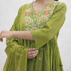 Green embroidered dress on a white background