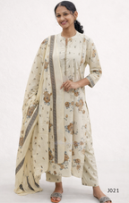 Woman wearing a floral kurta with a matching dupatta on a white background