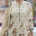 Beige floral dress with a matching dupatta on a blurred background