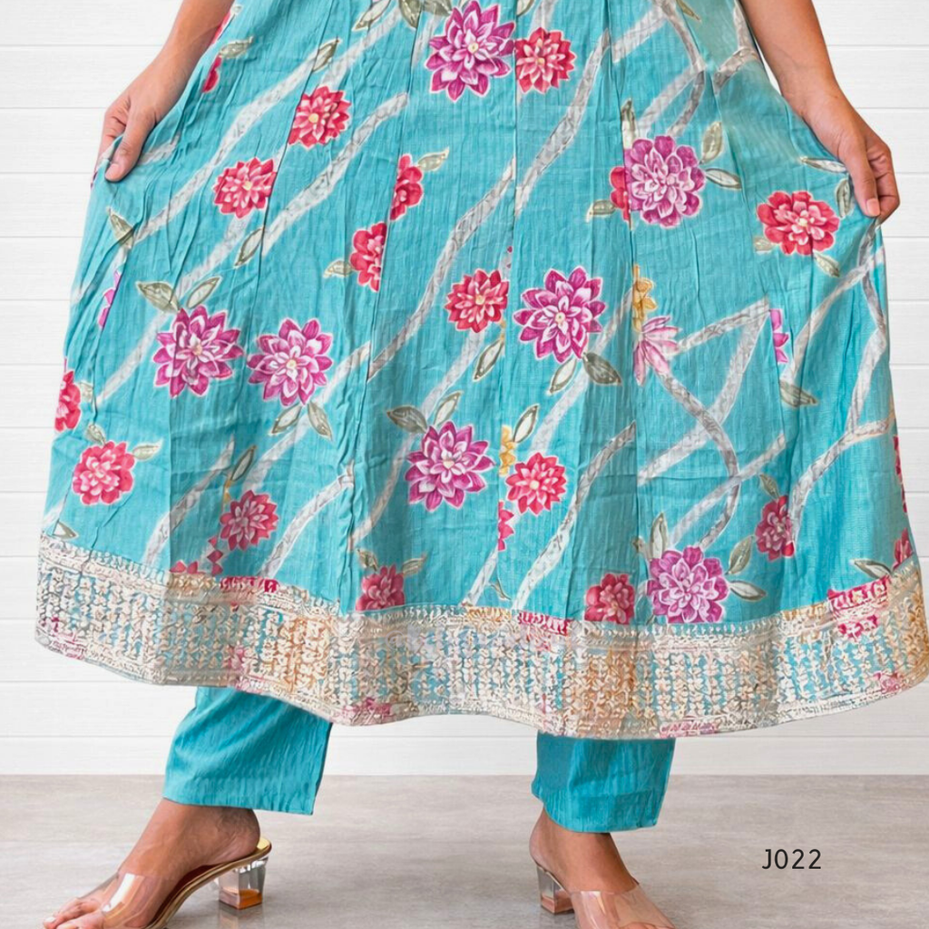 Teal floral dress with pink flowers on a white background